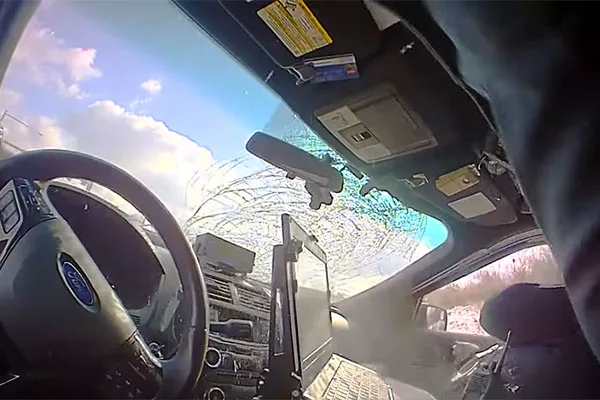 Read more about the article Truck tire comes crashing into parked police cruiser windshield